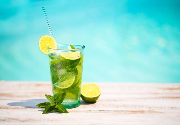 Cocktail glasses at pool, beach side. Mojito