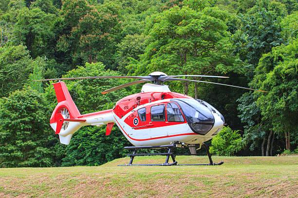 helicopter standing on landing strip in airfield