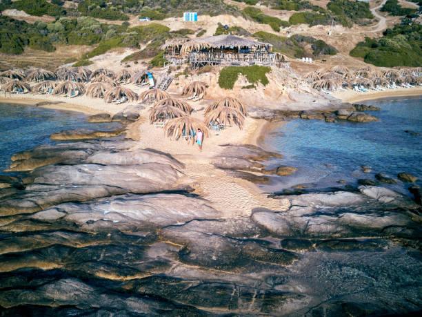 Beautiful beach and rocky coastline top aerial view drone shot, Sithonia, Greece
