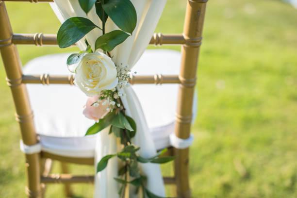 Wedding chair decorated with flowers.