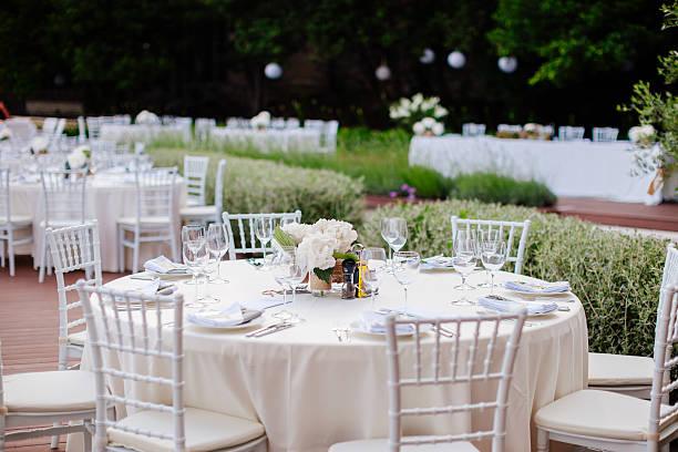 wedding table coverage with flowers decoration. Wedding venue ceremony.